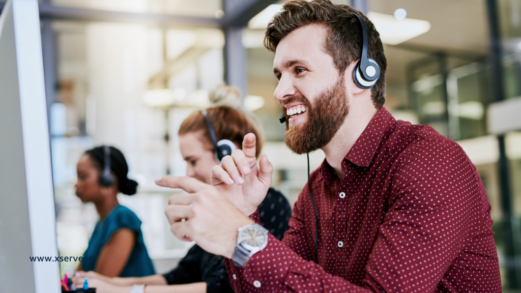 Happy call center employee signifying the advantages of outsourcing customer service.